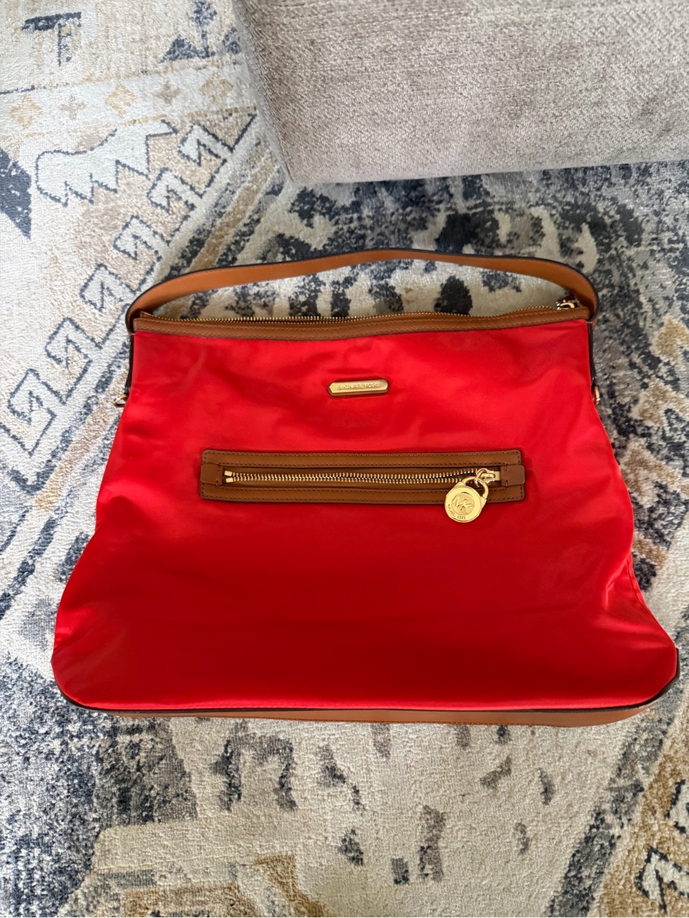 red and tan Michael Kors Kempton nylon shoulder bag featuring gold-tone hardware